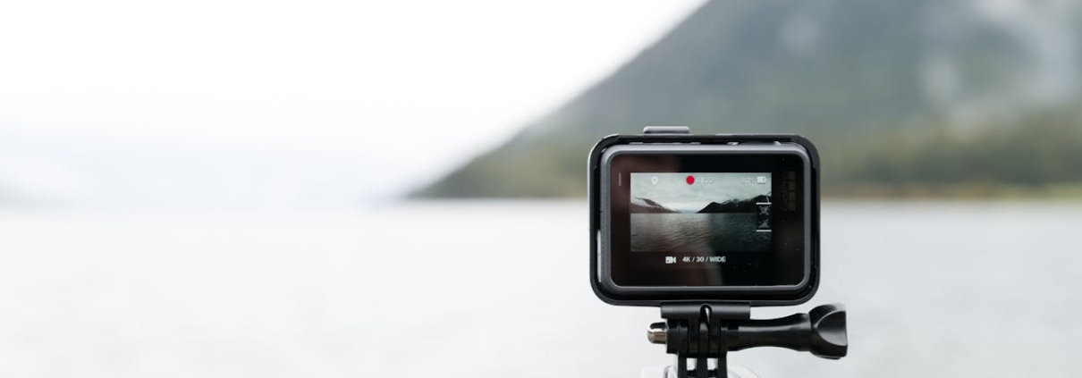 A photo of a GoPro camera shooting video of a body of water