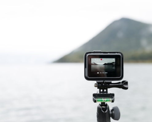 A photo of a GoPro camera shooting video of a body of water